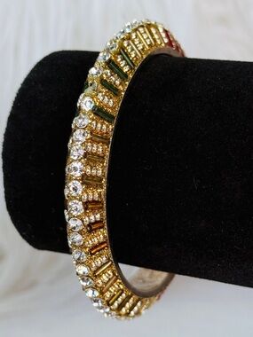 Vintage Goldtone red green, clear accent holiday bangle bracelet